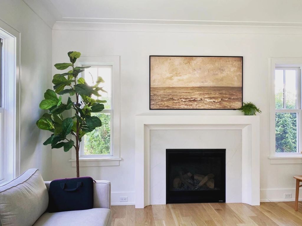 Bright living room with fireplace and integrated smart home controls